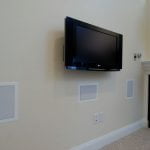 Wall mounted TV with in wall speakers